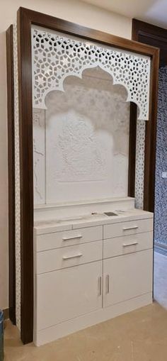 a white stove top oven sitting inside of a kitchen next to a wall mounted mirror