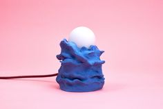 an egg sitting on top of a blue object