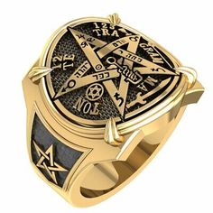 a gold and black ring with masonic symbols on it