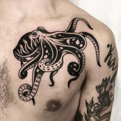 a man with an octopus tattoo on his chest