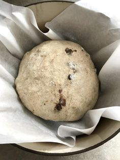 a close up of a doughnut in a paper wrapper