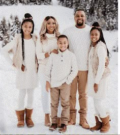 a family posing for a photo in the snow with text overlaying it that says explore