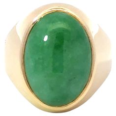 Item Specifications: Metal: 14k Yellow Gold Style: Statement Ring Ring Size: 8.75 (resizing available for a fee) Total Weight: 13.2 Grams Gemstone Specifications: Center Gemstone: Jadeite Jade Shape: Oval Color: Green Cut: Cabochon ​ ​Jade Measurements: ~18.5 mm x 13.3 mm 5.8 mm Jade Carat Weight: ~13 carats Condition: Vintage, Excellent ​ ​Stamped: "14k" Luxury Yellow Gold Emerald Ring With Oval Cabochon, Timeless Yellow Gold Oval Emerald Ring, Timeless Yellow Gold Emerald Ring With Oval Shape, Oval Gemstone Dome Ring In Yellow Gold, Oval Polished Emerald Ring In 14k Gold, Oval Emerald Ring With Polished Finish In 14k Gold, Oval Emerald Ring In 14k Gold With Polished Finish, Polished Yellow Gold Oval Cabochon Gemstones, Yellow Gold Polished Oval Cabochon Gemstones