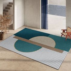 a room with a chair, rug and stairs in the middle is shown on an area rug that has been designed to look like a circle