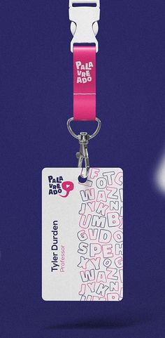 a pink and white luggage tag attached to a lanyard with the word fala on it