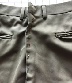 the side view of a pair of pants with buttons