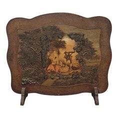 an old wooden frame with a painting on it