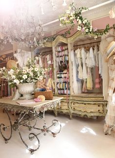 a room filled with lots of clothes and flowers