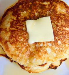 a stack of pancakes with butter on top