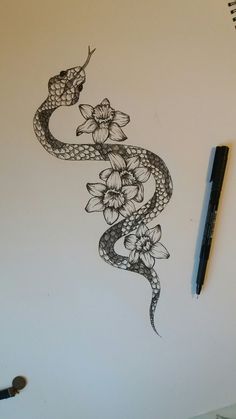 a drawing of a snake with flowers on it