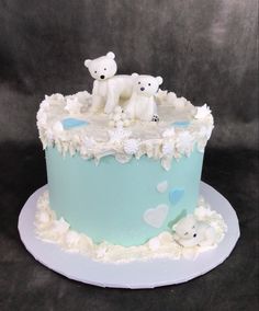 there is a cake that has two bears on it