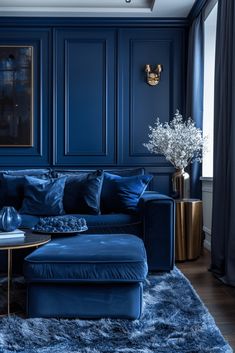 a living room with blue walls and furniture