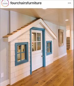 an empty room with white walls and blue trim on the doors, windows, and stairs