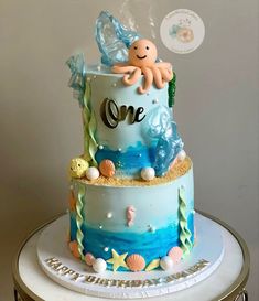 a cake decorated with an octopus and sea life