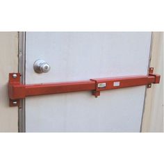 a door handle is attached to the side of a white door with red bars on it