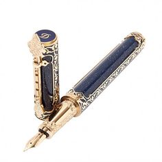 a fountain pen with an ornate design on the top and bottom, in gold plated metal