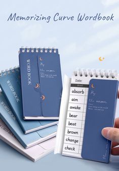 a hand holding a blue notebook with writing on it and the words memory care workbook next to it