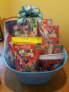 a blue bowl filled with candy and snacks