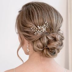 a woman wearing a wedding hair comb