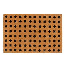 a brown door mat with black crosses on it