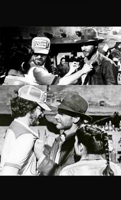 black and white photograph of men in hats talking to each other while another man holds his hat over his head