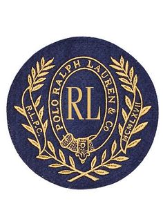 a blue and gold circle with the words rl on it, surrounded by laurels