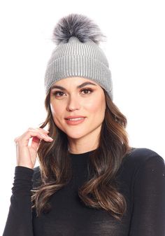 Crazy-cute and wearable, the Metallic Pom Hat is so cool, you'll wear it before the leaves fall. Why not--in Metallic Silver knit, it's stretchy and comfy. Better still, this substantial knit has recovery as well. Easy to pull on, the cap, when cuffed, measures 8" from the fur pom to the cuff fold. Ahhh, but the pièce de résistance is the oversize Grey Fox pom with Silver tipping. The magic of mixing Metallic knit with fur bestows a broad license to wear the Metallic Pom Hat with anything, every Warm Knit Hats For Fall, Winter Knit Fitted Bonnet, Fitted Knit Winter Bonnet, Gray Knitted Beanie For Fall, Winter Beanie Super Soft One Size, Super Soft Fall Beanie Hat, Knit Hats For Cold Weather In Fall, Super Soft Winter Beanie, Super Soft Winter Beanie One Size