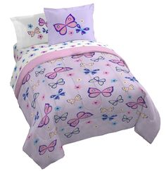 a bed with purple and blue butterflies on it