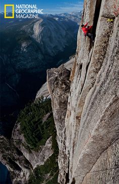 a man climbing up the side of a mountain