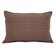 a brown pillow on a white background