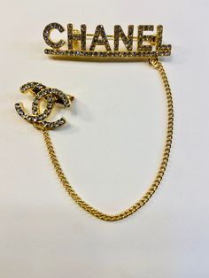 This CC brooch pin is beautiful and great quality. Alloy with Gold Plating, Gold Chain accent and rhinestones. 2 inches Across 1/2 inch Down Chain- 4 1/2 inches Down Little CC Pin- 3/4 inches Across, 1/2 inch Down Very cute! Perfect for blazer/jackets, hats, shirts and more! Chanel Pins, Cc Brooch, Run The Jewels, Chanel Brooch, Chanel Chain, Fun Socks, Chanel Inspired, Cross Chain, Fashion 2024