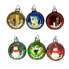 six christmas ornaments in different colors and designs, including one with a snowman on it