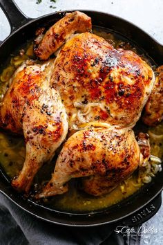 a close up of a chicken in a skillet