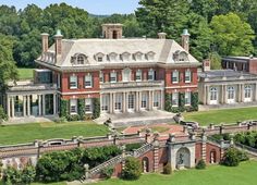 an aerial view of a large brick mansion