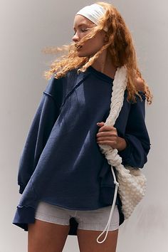 Cozy for on-the-go, this sweatshirt features a soft, terry fabrication in an oversized silhouette with a high-low hem for a chic take on the classic pullover. **Fit:** Relaxed fit; oversized; boat-neck **Features:** Soft, terry fabrication; boat-neck; oversized fit; high-low hem; ribbed detail at hem and cuffs; stitching detail throughout **Why We | One To Beat Pullover by FP Movement at Free People, Midnight Combo, S Style Roots, Pop Aesthetic, Southern Women, Graphic Tee Style, After Workout, James Dean, Soda Pop, Fp Movement, Oversized Silhouette