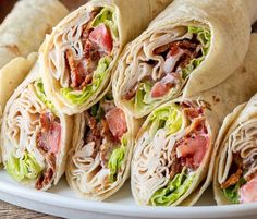 ~INGREDIENTS~
4 large tortillas
8 oz. deli sliced chicken breast
8 strips thick cut bacon, cooked crisp
2 cups lettuce leaves
1/2 cup diced tomatoes
4 tbsp ranch dressing

~INSTRUCTIONS~
Cook your bacon until nice and crisp
Assemble the wraps by laying a large flour tortilla down and then top with lettuce, diced tomatoes, ranch dressing, bacon and sliced chicken breast.
Use deli sliced chicken breast for a super quick wrap.
Roll up the wraps tightly and use a sharp knife to cut in half. Bacon Ranch Wraps, Easy Paleo Lunches, Ranch Wraps, Chicken Bacon Ranch Wrap, Clean Eating Lunch, Chicken Bacon Ranch, Easy Lunch Recipes, Bacon Ranch, Lunch Recipes Healthy