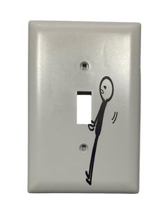 a light switch cover with a stick figure drawn on it