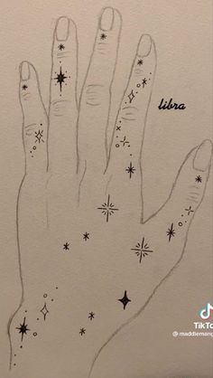 a hand with stars drawn on it and the words libra written in black ink