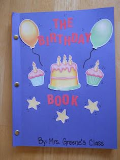 the birthday book has balloons and cupcakes on it