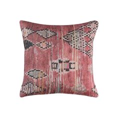 a pink and black pillow with an intricate design on the front, featuring multicolored squares