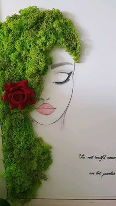 a woman's face made out of moss with a red rose in her hair