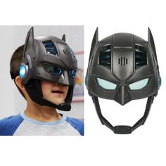 a boy wearing a batman helmet with glowing eyes