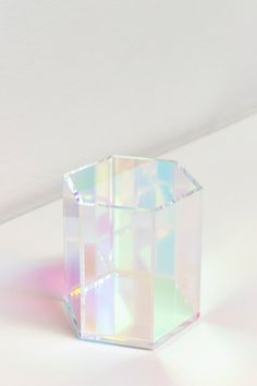 a small clear box sitting on top of a white table