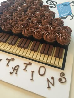 there is a cake with chocolate icing on it and the words nations spelled out