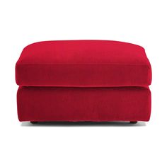 a red footstool sitting on top of a white floor