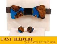 We are glad to present unique gift box for men - original bow tie and cufflinks of black resin and wood. Dimensions of bowtie: Width: 108 mm / 4.25in Length: 43 mm / 1.69in Diameter of cufflinks: 20 mm / 0.78in > High quality materials: - The finest timber of wild olive -- strong, stable and having beautiful color and grain is carefully selected by us. The epoxy-filled area has a natural edge, without disrupting the natural grain of the wood. - The item is finished with a durable varnish, which Elegant Adjustable Suit And Tie Accessories For Gifts, Cufflinks For Father's Day Gift, Elegant Suit And Tie Accessories Gift Box, Dapper Blue Tie For Gift, Dapper Blue Tie Suitable For Gift, Dapper Blue Tie As Gift, Father's Day Jewelry Gift With Ties, Blue Bow Tie As A Gift, Adjustable Suit And Tie Accessories For Father's Day Gift