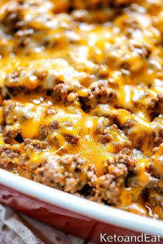 a casserole dish with cheese and ground beef