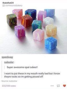 a bunch of different colored cubes sitting next to each other