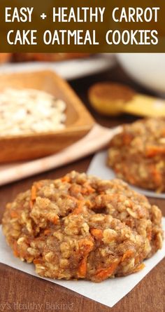 two cookies are sitting on top of napkins next to some oranges and bananas