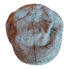 a brown and blue hat on top of a white background